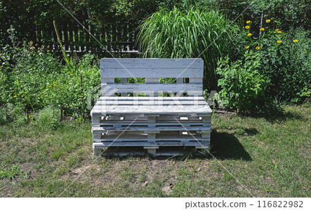 Bench made of wooden pallets in the garden Bench made of wooden pallets in the garden 116822982