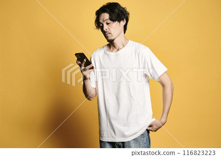 A man touching a smartphone with a colored background 116823223