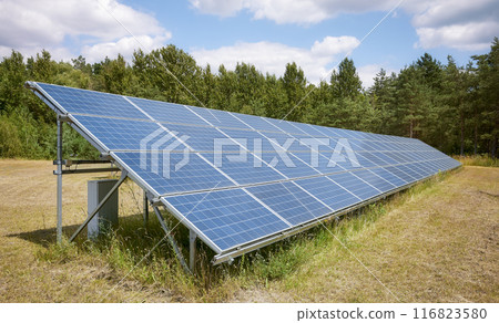 Photo of photovoltaic panels in a field, selective focus. Photo of photovoltaic panels in a field, selective focus. 116823580