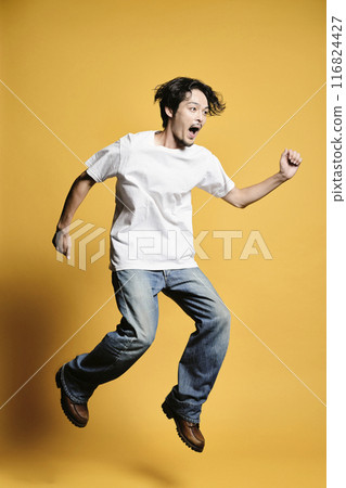 A man jumping with a colored background 116824427