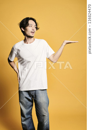 A man posing as a guide on a colored background A man posing as a guide on a colored background 116824470