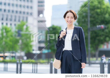 A middle-aged businesswoman commuting to the office A middle-aged businesswoman commuting to the office 116824639
