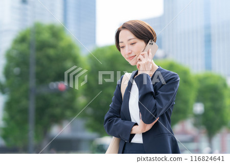 A middle-aged businesswoman commuting to the office A middle-aged businesswoman commuting to the office 116824641