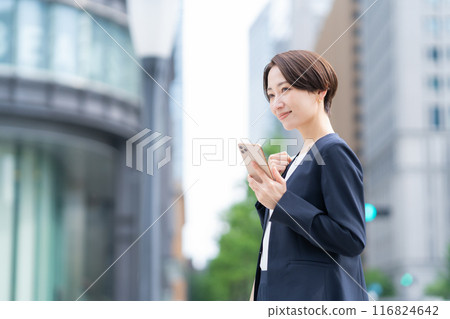A middle-aged businesswoman commuting to the office A middle-aged businesswoman commuting to the office 116824642