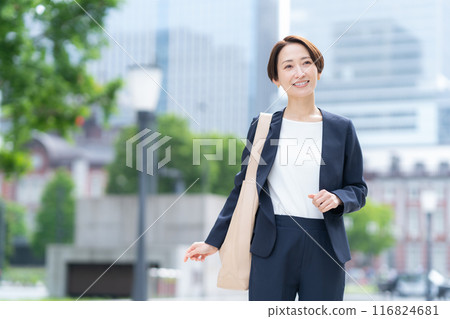 Middle-aged business woman working in an office district 116824681