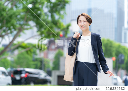 Middle-aged business woman working in an office district 116824682