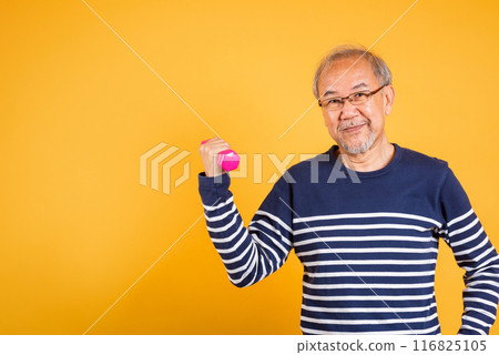 Portrait Asian smiling old man holding a pink dumbbell lifts it with strength and power studio shot isolated yellow background, senior man pensioner, Body care, weight loss lifestyle Portrait Asian smiling old man holding a pink dumbbell lifts it with strength and power studio shot isolated yellow background, senior man pensioner, Body care, weight loss lifestyle 116825105