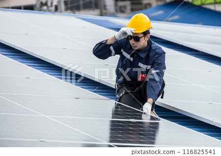 Professional Engineer Service Solar Panel. Worker Maintenance Cleaning Replacing Solar Panel. Solar photovoltaic panel system in Industry roof. Saving Energy with Clean Power. 116825541