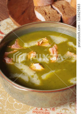 Vegetable cream soup with kale leaves and salmon fish with cheese. Healthy food. Cook for health.  116825663