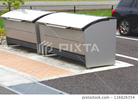 A collection point with trash collection boxes set up 116826354