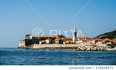 Ancient architecture in Montenegro, Adriatic sea view. Old Mediterranean buildings with red roofs and scenic nature Ancient architecture in Montenegro, Adriatic sea view. Old Mediterranean buildings with red roofs and scenic nature 116826475