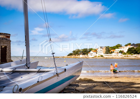 White boat on beautiful sea beach in sunny day closeup. Travel ocean transportation on scenic seascape with blurred background 116826524
