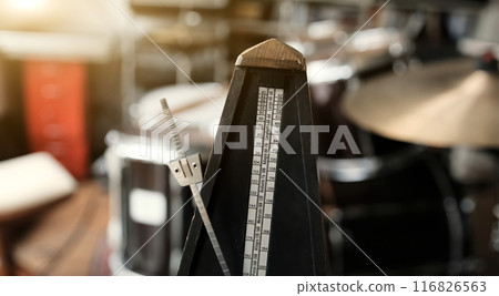 Mechanical metronome for music rhythm and tact measuring in motion with sound. Classical tool for musicians and song creators Mechanical metronome for music rhythm and tact measuring in motion with sound. Classical tool for musicians and song creators 116826563