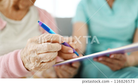 Nurse Helping For Elderly Woman For Sign Documents At Nursing Home Nurse Helping For Elderly Woman For Sign Documents At Nursing Home 116826573