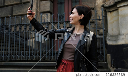 Attractive Woman Strolls In Dresden'S Touristic Center, Capturing Photos Of City'S Sightseeing Spots Attractive Woman Strolls In Dresden'S Touristic Center, Capturing Photos Of City'S Sightseeing Spots 116826589