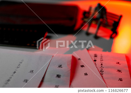 The drawing doll depicts a man sitting on a bench looking lost and at a loss, with a large number of resignation letters written incorrectly, and is illuminated in red. The drawing doll depicts a man sitting on a bench looking lost and at a loss, with a large number of resignation letters written incorrectly, and is illuminated in red. 116826677