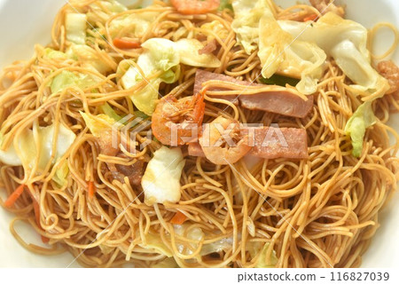 stir fried Hong Kong noodles cabbage and meat with slice bacon topping dry shrimp on plate stir fried Hong Kong noodles cabbage and meat with slice bacon topping dry shrimp on plate 116827039