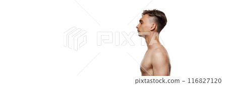 Banner. Side view portrait of young man posing shirtless against white studio background with negative space to insert text. Banner. Side view portrait of young man posing shirtless against white studio background with negative space to insert text. 116827120