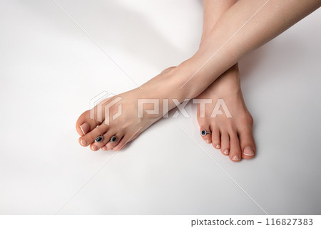 slender long female legs on a white background 116827383