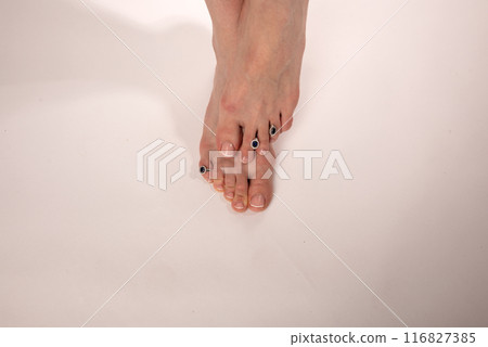 slender long female legs on a white background slender long female legs on a white background 116827385