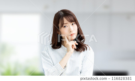 A Japanese businesswoman thinking in the office 116828381