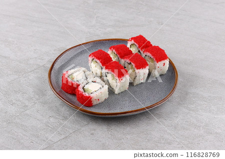 Japanese cuisine. Sushi roll on white background. Japanese cuisine. Sushi roll on white background. 116828769