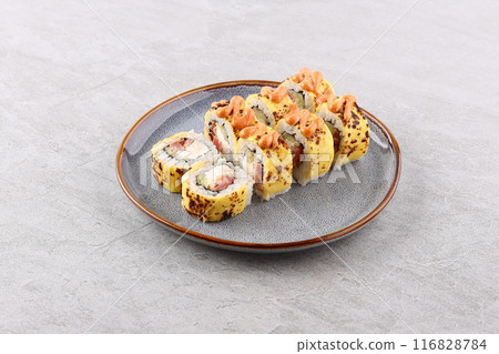 Japanese cuisine. Sushi roll on white background. Japanese cuisine. Sushi roll on white background. 116828784