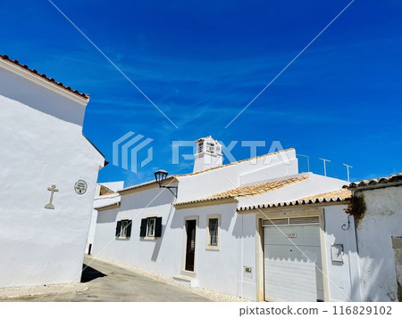White houses and narrow streets in Loule, Algarve, Portugal 116829102