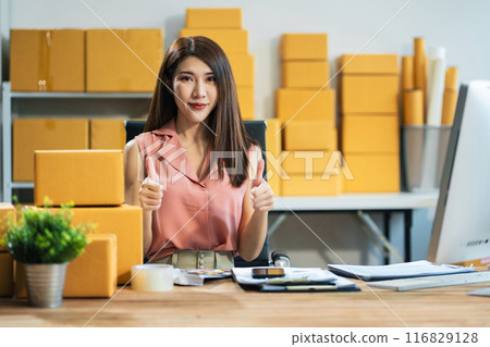Successful Woman online seller. small business entrepreneur SME or Asian woman working freelance with online sell at home. 116829128