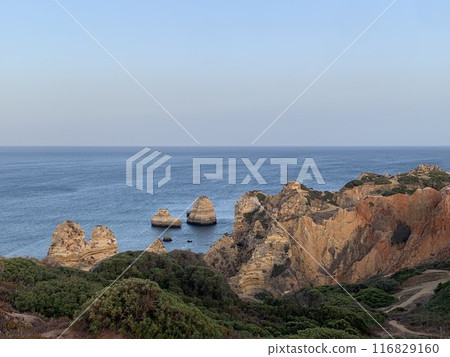 Carvoeiro boardwalk over the Algarve cliffs in Portugal. Carvoeiro boardwalk over the Algarve cliffs in Portugal. 116829160