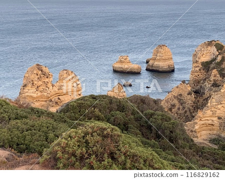 Carvoeiro boardwalk over the Algarve cliffs in Portugal. Carvoeiro boardwalk over the Algarve cliffs in Portugal. 116829162