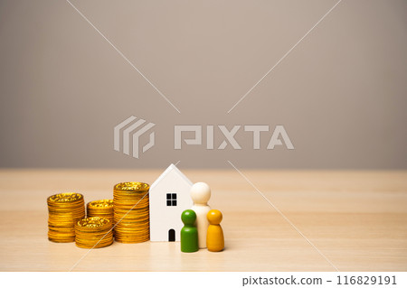 Miniature figures of the family stand near the house and coins. The concept of family budget, mortgage lending and money in the family. Real estate and housing Miniature figures of the family stand near the house and coins. The concept of family budget, mortgage lending and money in the family. Real estate and housing 116829191