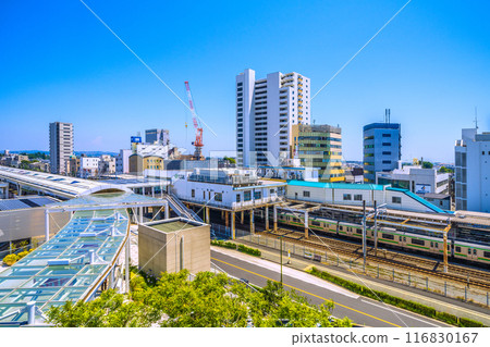 Fujisawa cityscape in Japan in July. View of Tsujido Station on the Tokaido Main Line and trains (orange and green Shonan colored) on the 22nd Fujisawa cityscape in Japan in July. View of Tsujido Station on the Tokaido Main Line and trains (orange and green Shonan colored) on the 22nd 116830167