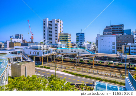 Fujisawa cityscape in Japan in July. View of Tsujido Station on the Tokaido Main Line and trains (orange and green Shonan colored) on the 22nd 116830168