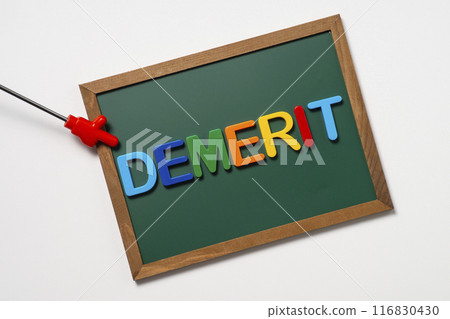 The word "demerit" written on a blackboard and a pointer The word "demerit" written on a blackboard and a pointer 116830430