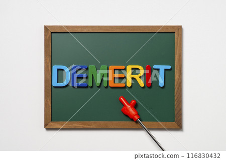 The word "demerit" written on a blackboard and a pointer The word "demerit" written on a blackboard and a pointer 116830432