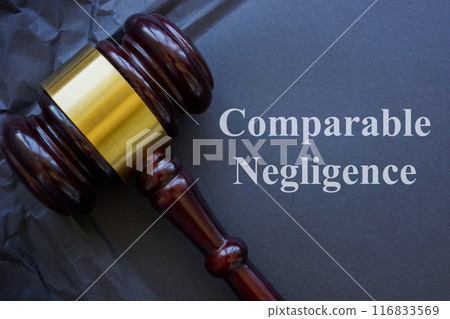 Comparable negligence concept. Gavel and crumbled dark paper. 116833569