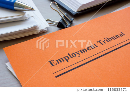 Stack of papers and employment tribunal documents. 116833571