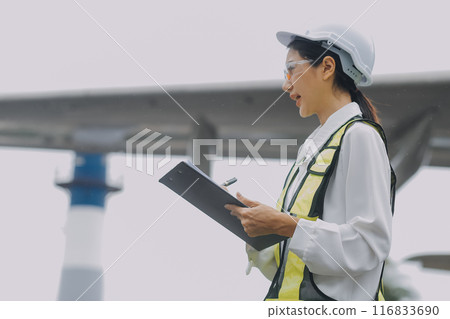 Technician fixing the engine of the airplane,Female aerospace engineering checking aircraft engines,Asian mechanic maintenance inspects plane engine 116833690