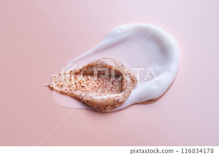 Cream and cream scrub on a pink background. Texture. 116834178