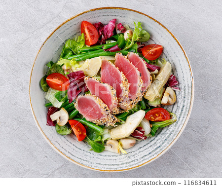 Tuna salad on a gray background. Nicoise salad, for restaurant menu for delivery 116834611