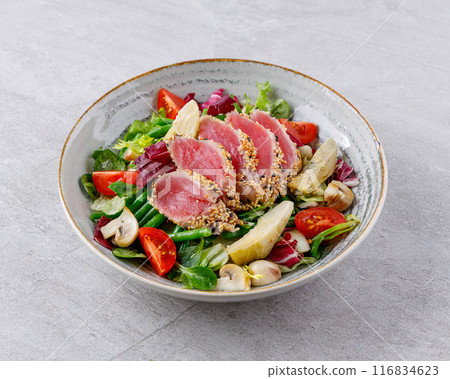 Tuna salad on a gray background. Nicoise salad, for restaurant menu for delivery Tuna salad on a gray background. Nicoise salad, for restaurant menu for delivery 116834623