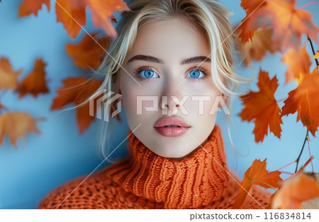 Woman in Orange Sweater With Autumn Leaves 116834814