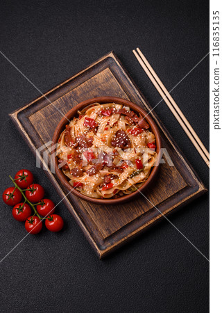 Delicious asian udon dish with vegetables, meat, salt and spices Delicious asian udon dish with vegetables, meat, salt and spices 116835135