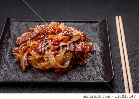 Delicious asian udon dish with vegetables, meat, salt and spices Delicious asian udon dish with vegetables, meat, salt and spices 116835147