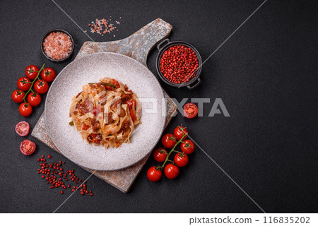 Delicious asian udon dish with vegetables, meat, salt and spices 116835202