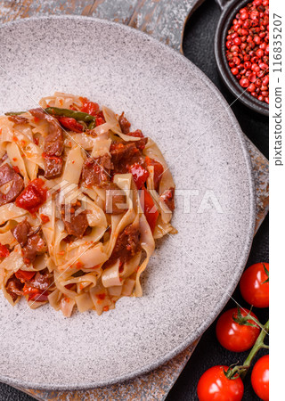 Delicious asian udon dish with vegetables, meat, salt and spices Delicious asian udon dish with vegetables, meat, salt and spices 116835207