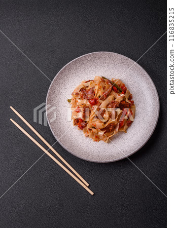 Delicious asian udon dish with vegetables, meat, salt and spices 116835215