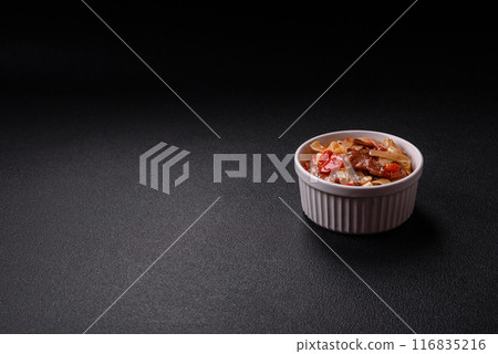 Delicious asian udon dish with vegetables, meat, salt and spices 116835216