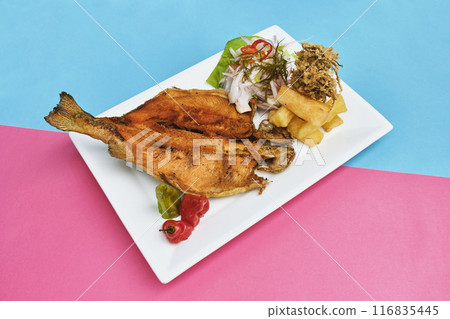 PERUVIAN FOOD, typical dish Fried trout, with rice, yucca and salad, Sective Focus 116835445